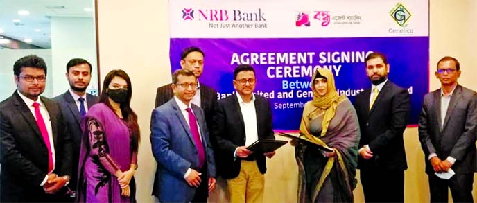 Mamoon Mahmood Shah, Managing Director and CEO (CC) of NRB Bank Limited and Ashmita Irad Ali, Managing Director of Genetica Industries Limited, exchanging documents after signing an agreement at the bank's Corporate Head Office on Monday. As per the deal