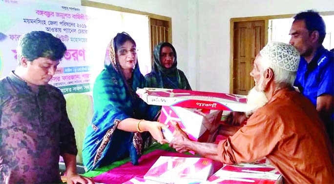 Farzana Sharmin Beauty, Panel Chairman of Mymensingh Zila Parishad, distributes ceiling fan to various mosques and madrasas of Bhabanipur union in Phulbaria Upazila (Mymensingh) at a function held at the union parishad premises on Wednesday.