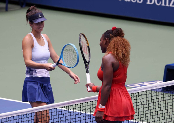 Serena Williams (right) of the United States taps rackets with Tsvetana Pironkova (left) of Bulgaria after winning her women's singles quarter-final match on Day Ten of the 2020 US Open at the USTA Billie Jean King National Tennis Center in the Queens bo