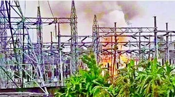 Thick black smog billows over the PGCB grid substation at Mymensingh's Kewatkhali power station after a fire broke out there on Thursday.