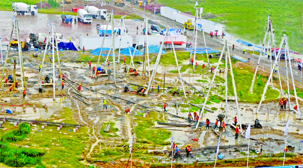 Construction work of Bangabandhu Tri Tower in the city's Purbachal goes on in full swing. The snap was taken from the spot on Friday.