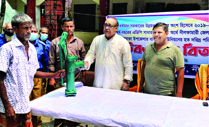 As part of the government's development programme, Nilphamari Zila Parishad Administrator Md Joynal Abedin distributes tubewells among the poor and helpless people of Balagram Union of Jaldhaka Upazila in Nilphamari recently.