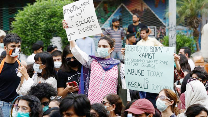 Protesters in Karachi carry signs against a gang rape that occurred along a highway and to condemn violence against women and girls.