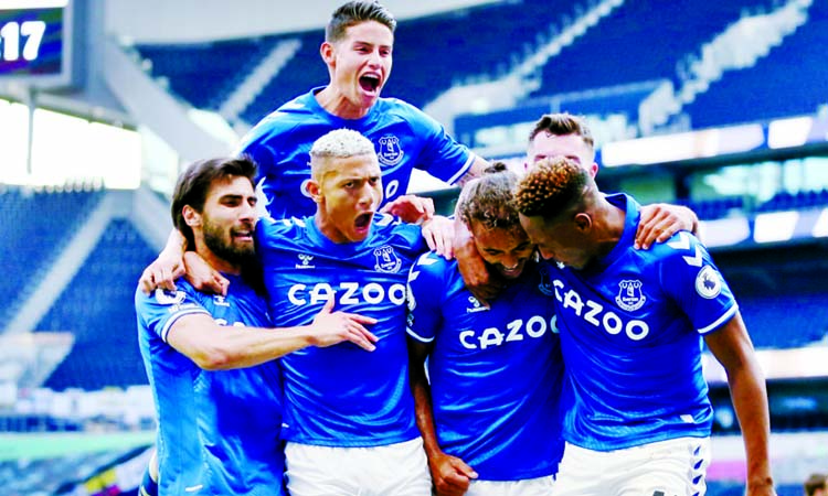 Everton's Dominic Calvert-Lewin (2nd right) celebrates scoring their first goal with teammates during their Premier League match against Tottenham Hotspur at Tottenham Hotspur Stadium in London on Sunday.