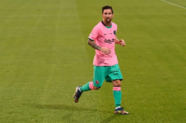 Lionel Messi celebrates after scoring during a friendly football match between FC Barcelona and Girona at the Johan Cruyff stadium in Sant Joan Despi near Barcelona on Wednesday.