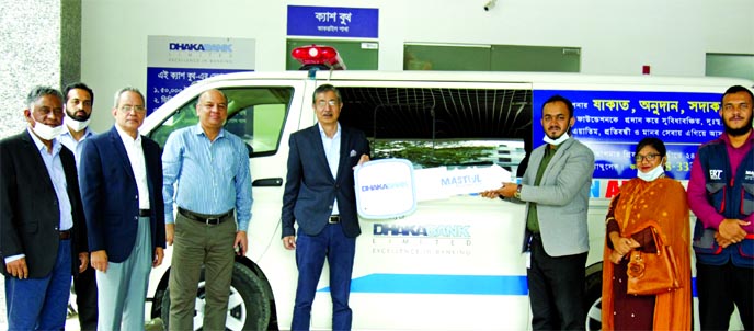 Emranul Huq, Managing Director and CEO of Dhaka Bank Limited, handing over the Ambulance Key to Kazi Reaz Rahman, Founder and Executive Director of MASTUL Foundation, with the presence of Mohammad Abu Jafar, AKM Shahnawaj, DMDs and Arham Masudul Huq, CEO