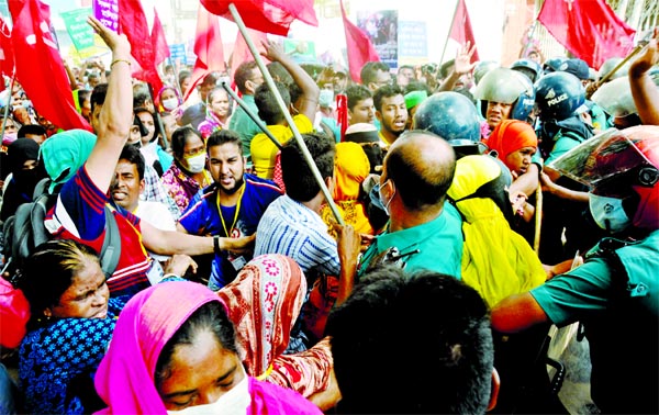 Police thwart a procession of garment workers marching towards Home Ministry in front of Bangladesh Secretariat on Thursday.