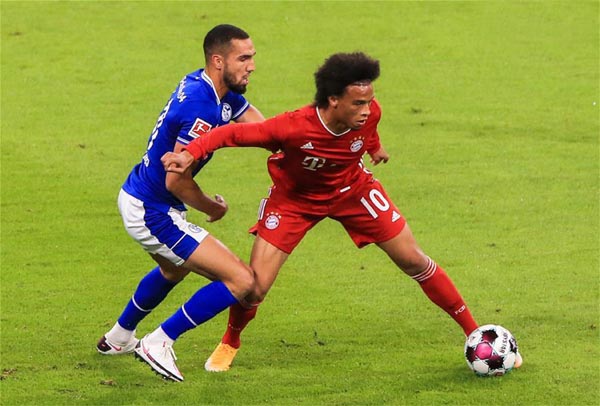 Leroy Sane (right) of Bayern Munich vies with Nabil Bentaleb of Schalke 04 during a German Bundesliga match in Munich, Germany on Friday.