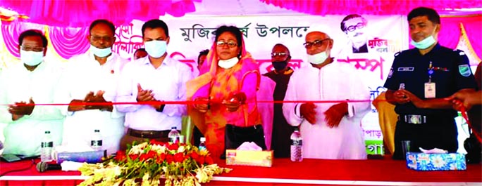 Prime Minister's assignment officer Afroza Binte Mansur (Gazi Lipi) inaugurates a medical camp as chief guest at the field of Barshapra Government Primary School in Kotalipara upazila of Gopalganj district on Saturday organised by 'Gyaner Alo Pathaghar