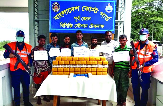 Members of Bangladesh Coast Guard produce seven drug traffickers before media along with five lakh Yaba pills on Sunday after their arrest from the Bay of Bengal.