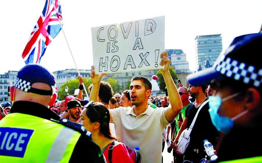 People gather in Trafalgar Square to protest against the lockdown imposed by the government, following the outbreak of the coronavirus, in London, Britain on Saturday.