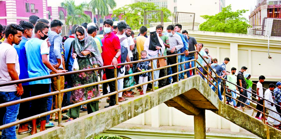 Pedestrians have to use the dilapidated foot over-bridge at Babubazar in the capital taking risk of accident as road adjacent to the bridge dug up by civic bodies for development works. This photo was taken on Sunday.