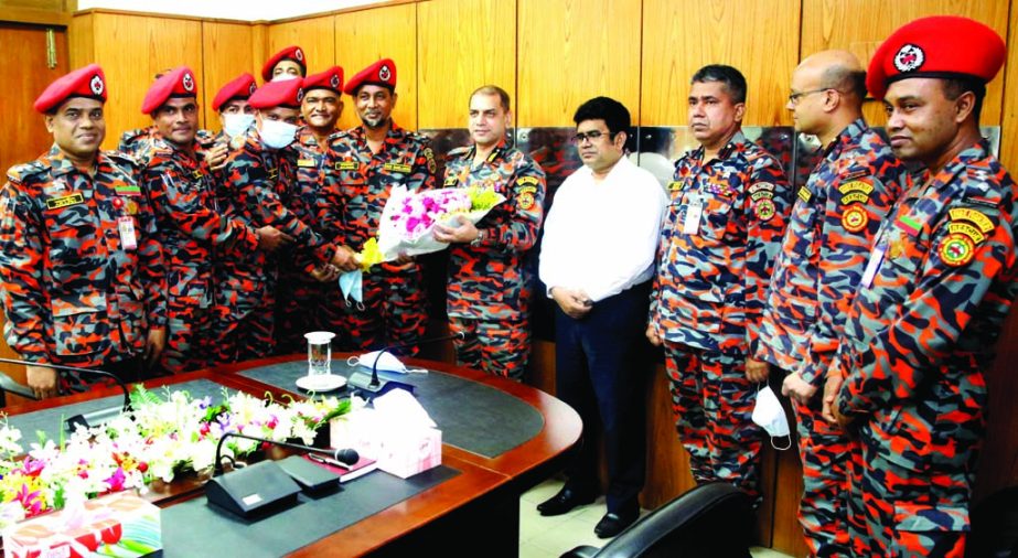 Promoted 19 officials of the Fire Service and Civil Defence (FSCD) call on its Director General Brigadier General Sazzad Hossain, ndc, afwc giving bouquet at FSCD Directorate in the city on Tuesday