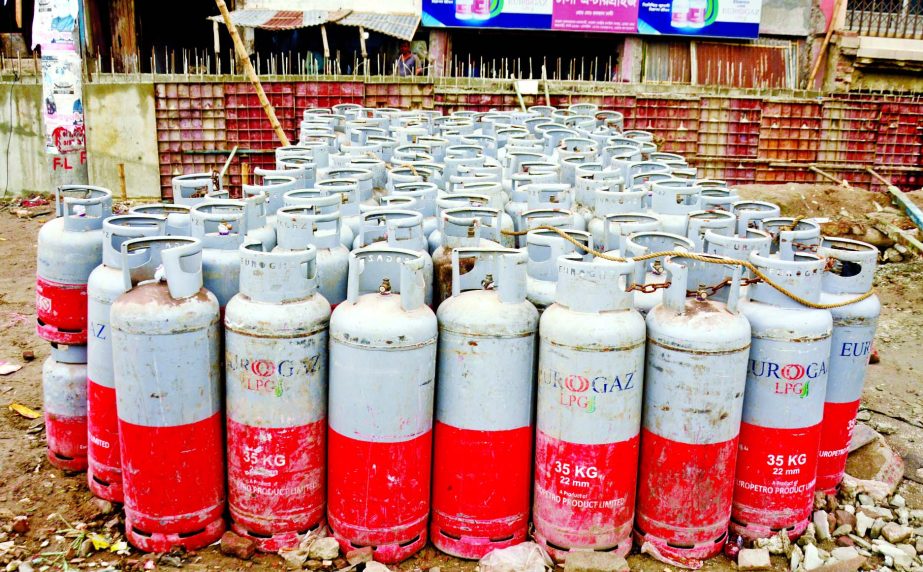 LPG cylinders are found piled up at an open space besides the residential area of Kazla in the capital on Tuesday, as most traders are reluctant to safely store cylinders.