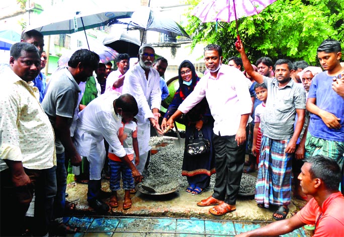 Alhaj Sirajul Islam Khan Raju, Upazila Chairman and General Secretary of Upazila Awami League, inaugurates the casting work of the 500-meter RCC road at Talson village in Bogura's Adamdighi Upazila Sadar on Thursday.