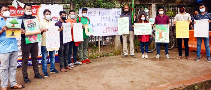 Organizers of Fridays for Future Bangladesh forms a human chain in front of the Jatiya Press Club on Friday to realize its 8-point demands marking Global Day for Climate Action.