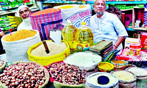 A vendor waits for customer at a kitchen market in the capital's Gopibagh on Friday amid rising rice and cooking oil prices in the city market.