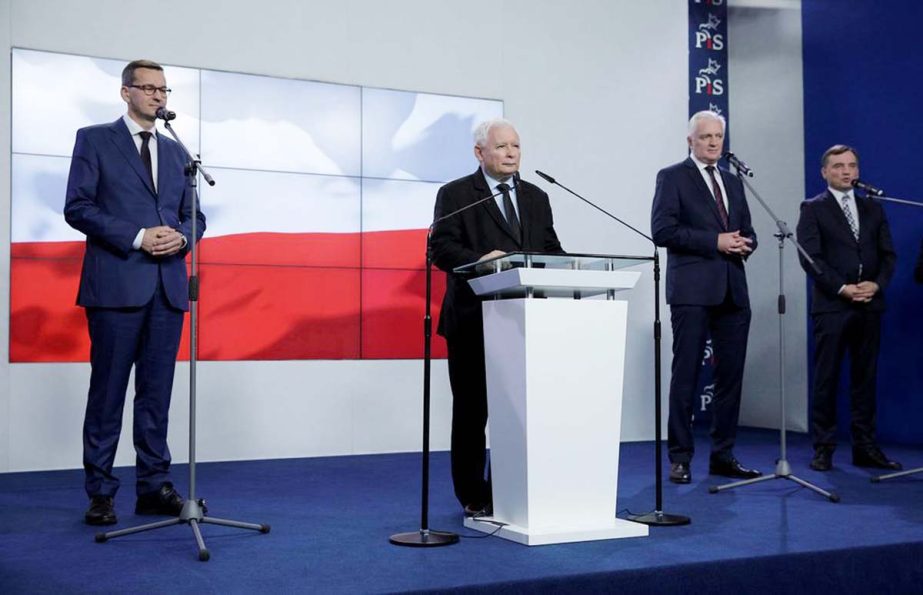 Poland's Prime Minister Mateusz Morawiecki, leader of Law and Justice party Jaroslaw Kaczynski, leader of Agreement party Jaroslaw Gowin, and leader of United Poland party Justice Minister Zbigniew Ziobro, attend a news conference after signing coalition