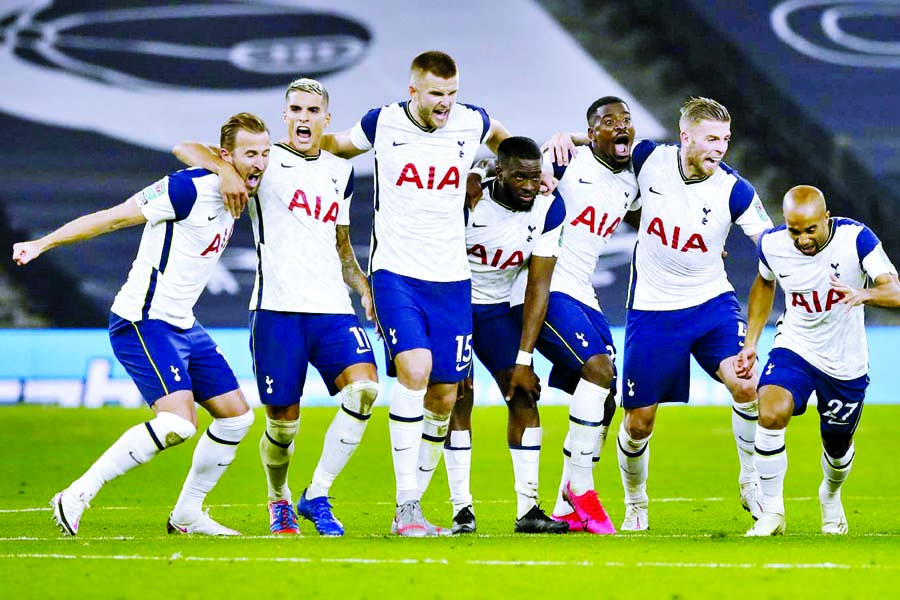 Tottenham players celebrate during the English League Cup fourth round soccer match against Chelsea at Tottenham Hotspur Stadium in London, England on Tuesday. Tottenham defeated Chelsea 5-4 on penalties.