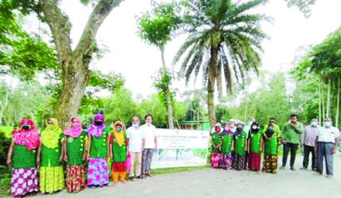Upazila Engineer of Gopalpur (in Tangail) Abul Kalam Azad along with other officials pose for a photograph during inauguration of the 'Rural Road Maintenance Month- October 2020' in the upazila on Thursday.