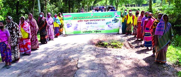 Officials of Fatickchhari upazila (in Chattogram) pose for a photograph during inauguration of the 'Rural Road Maintenance Month-October 2020 in the upazila on Thursday.