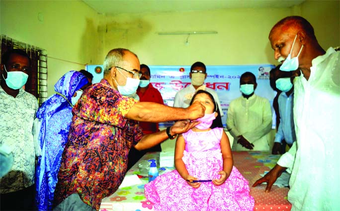 Rangpur City Corporation Mayor Mostafizur Rahman Mostafa inaugurates the Vitamin A plus campaign at Jummapara Club in city on Sunday by feeding a capsule to a child.