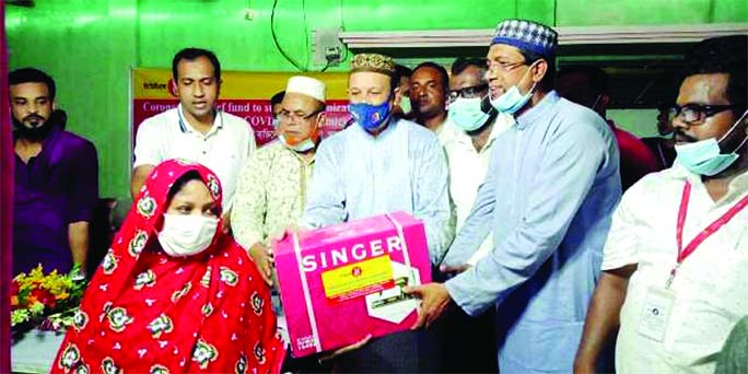 Barguna-2 MP Shawkat Hachanur Rahman Rimon distributes sewing machines among the poor and disabled people on Saturday.