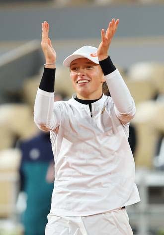 Poland's Iga Swiatek celebrates after winning her French Open quarter-final against Italy's Martina Trevisan at Roland Garros stadium in Paris, France on Tuesday.
