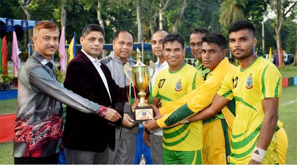 Assistant Chief of Bangladesh Air Force (BAF) Air Vice-Marshal Md Quamrul Ehsan handing over the championship trophy to BAF Base Bir Sreshto Matiur Rahman team at Bangladesh Air Force Base Bir Sreshto Matiur Rahman Hockey Ground on Thursday. BAF Base Bir