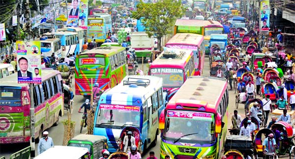 A road in the capital's Nayabazar area gets clogged on Thursday amid increased traffic.