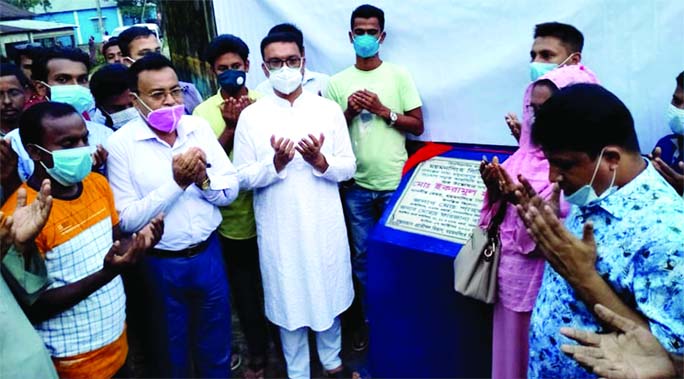 Mayor Md. Ikramul Haque Titu along with other officials offer Munazat while inaugurating various developmental works of Ward No 33 of Mymensingh City Corporation on Wednesday.