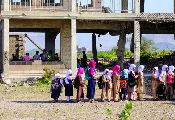 Yemeni pupils stand in line ahead of class on the first day of the new academic year.