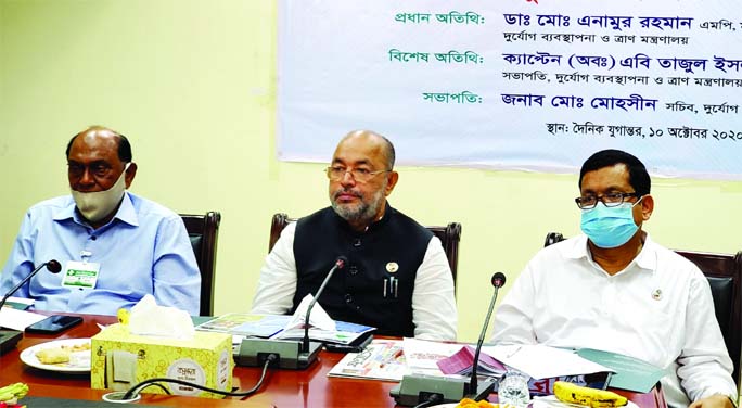 State Minister for Disaster Management and Relief Dr. Enamur Rahman speaks at a roundtable meeting at the conference room of the daily Jugantar on Saturday marking International Disaster Reduction Day.