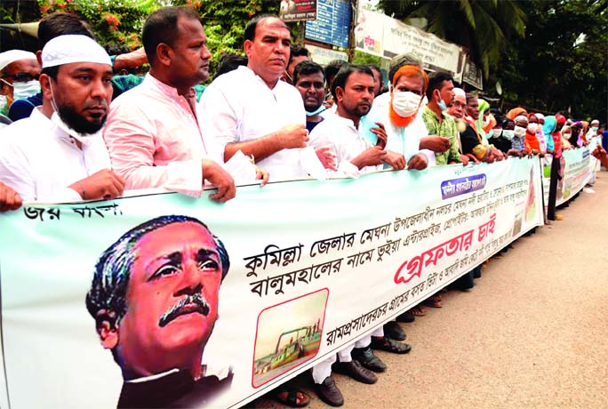 Affected people forms a human chain in front of the Jatiya Press Club on Saturday with a call to stop lifting sand from Meghna river under Meghna Upazila in Cumilla district to protect home land.