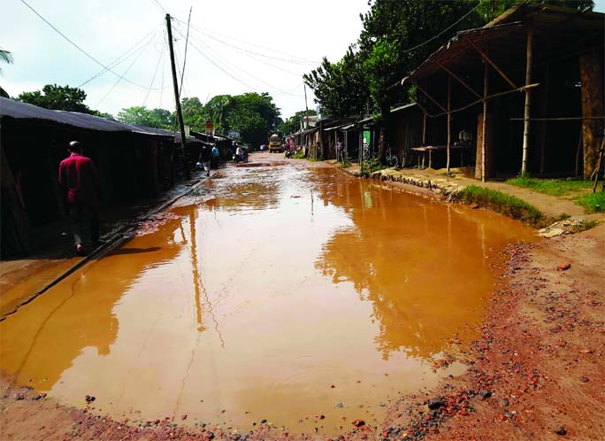 A big pothole developed on Nazirhat College Road (Fatikchari Ramgarh Section-1) due to lack of maintenance and repair of the road. This photo was taken on Friday.