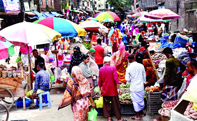 With the help of influential quarters, vendors set up unauthorized shops occupying the Maniknagar main road in the capital. This photo was taken on Saturday.