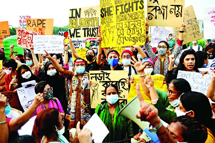 Women activists hold placards and raise slogans during a demonstration at the Manik Mia Avenue in the capital on Saturday protesting the rape, sexual assaults and violence against women in the country.