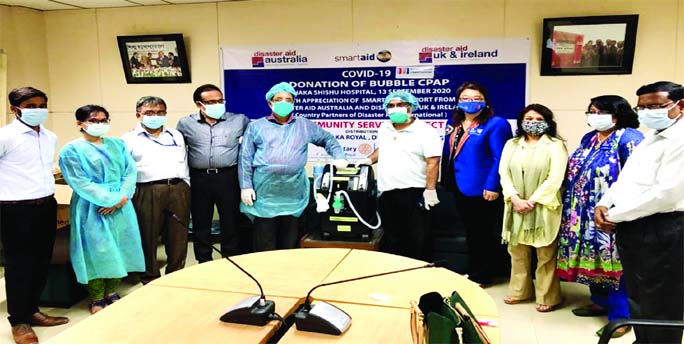 Officials of Rotary Club of Dhaka Royal donate a Bubble CPAP machine to the authority concerned of Dhaka Shishu Hospital (DSH) recently.