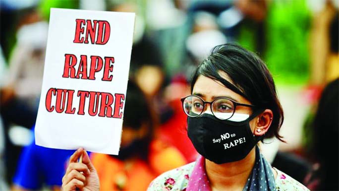 A woman protests in front of the National Parliament building over rising incidents of rape in the country.