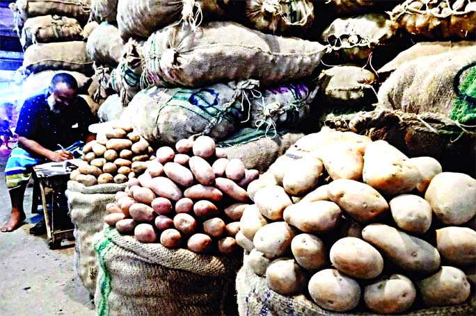 Despite fixing price of potato by the Department of Agriculture, the traders are selling this vegetable item in higher prices defying government order. This photo taken from city's Kawran Bazar on Wednesday shows plenty of potatoes are kept stock at the