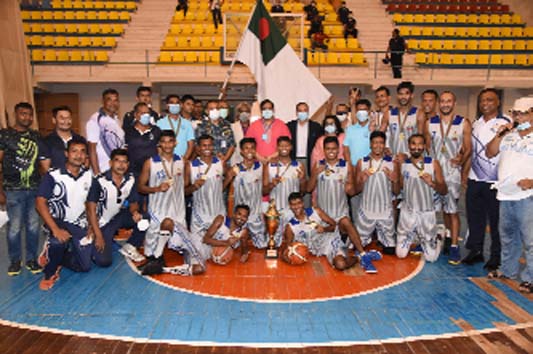 Members of Bangladesh Navy, the champions in the Bangabandhu Federation Cup Basketball Tournament with the chief guest State Minister for Youth and Sports Zahid Ahsan Russell, MP, and the officials of Bangladesh Basketball Federation pose for a photo sess