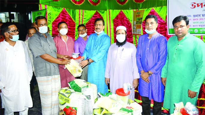 Manoranjan Shill Gopal, MP, distributes agricultural materials among the farmers at a function held at the Birganj (Dinajpur) Upazila premises on Wednesday.