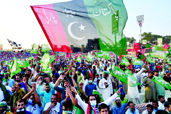 Activists of the newly-formed Pakistan Democratic Movement, an opposition alliance of 11 parties, wave parties flags during the first public rally, in the eastern city of Gujranwala on Friday.