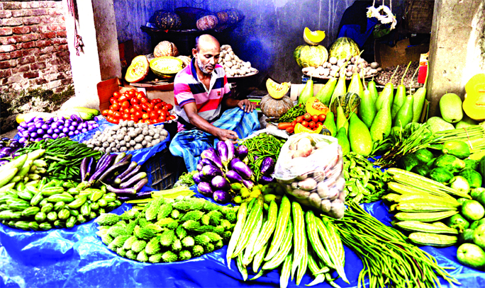 Most of the essential kitchen items, including vegetables, have gone beyond the purchasing capacity of commoners due to abnormal price hike. This photo, taken from Moulavi Bazar on Saturday, shows a lone vendor sitting along with his commodities with no p