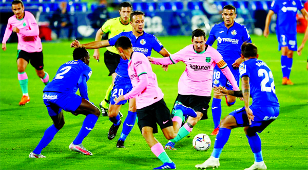 Barcelona's Lionel Messi (third from right) in action with Getafe's Nemanja Maksimovic at the Alfredo Di Stefano stadium in Valdebebas, northeastern Madrid on Saturday.