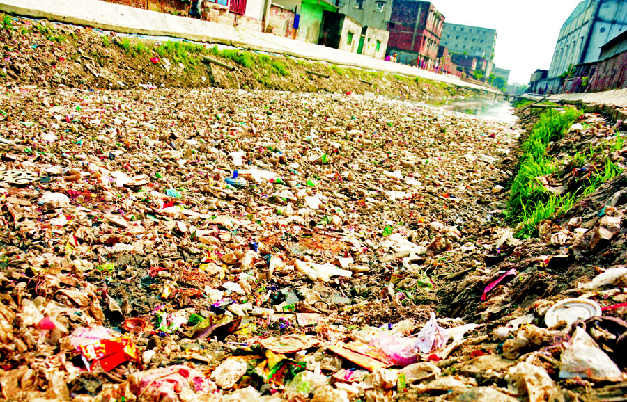 The Hazaribagh canal in the capital almost vanished and it looked like a landfill due to careless dumping of garbage. This photo was taken on Sunday.