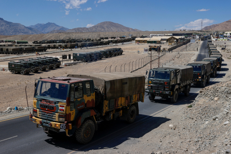Indian army trucks carrying supplies move in convoy towards areas in the Ladakh region.