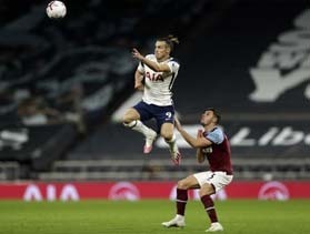 Tottenham Hotspur's Welsh striker Gareth Bale (left) jumps above West Ham United's English defender Aaron Cresswell during the English Premier League football match between Tottenham Hotspur and West Ham United in London on Sunday.