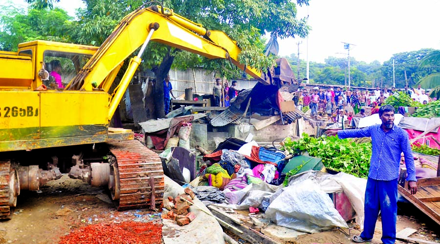 The Railway authorities conduct an eviction drive against illegal encroachers at Ambagan in Chattogram City on Monday.