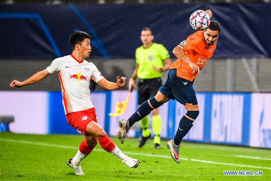 Hwang Hee-chan (L) of Leipzig vies with Rafael of Istanbul Basaksehir during the UEFA Champions League Group H first round football match between RB Leipzig of Germany and Istanbul Basaksehir FK of Turkey in Leipzig, Germany on Tuesday.